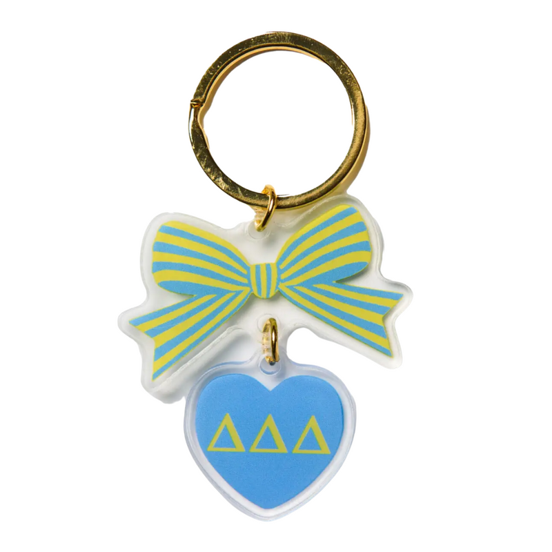 Add a splash of charm to your keys with the Bow-Dacious Key Chain! Featuring a delightful bow design accented with your sorority letters, this playful accessory is perfect for showing off your sisterhood pride in style. Compact and cute, it’s an ideal gift or a fun treat for yourself to keep your keys looking fabulous.