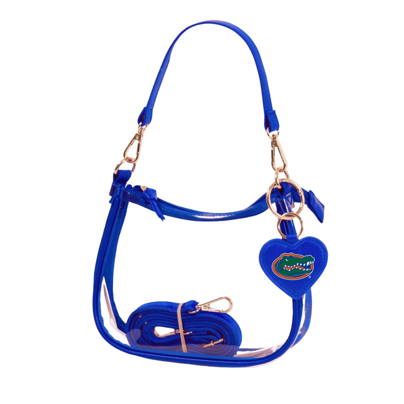 Our new Clara Clear Bag perfectly blends function and fashion, meeting stadium regulations with a chic design. It features a durable PVC body, secure zipper closure, and two interchangeable straps, keeping your essentials stylish and secure on game day.&nbsp;