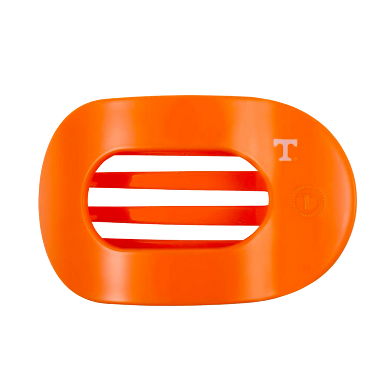 Unwind and relax with the new TELETIES Flat Round Hair Clip! Designed with the same innovative material that is nearly unbreakable, this clip is perfect for lying down, doing yoga or simply laying back without discomfort.&nbsp;Hold your hair and enhance your style with the new University of Tennessee TELETIES Clip! Go Vols! 