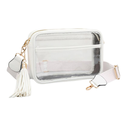 It's Here!!! Our Game Day stadium compliant crossbody zip bag! Featuring a clear PVC body with white trim and gold metal accents. Comfortable and roomy, this bag is perfect for the Game Day girl who likes to come prepared!