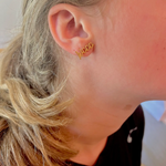 Show your Razorback pride in style with these Woo Pig gold stud earrings. Compact and dazzling, they add a subtle yet spirited touch to any outfit. Perfect for game days or everyday wear, these earrings let you celebrate your team wherever you go with a playful, gleaming finish.