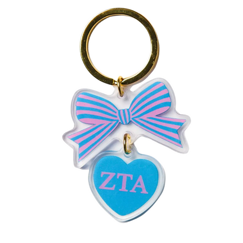 Add a splash of charm to your keys with the Bow-Dacious Key Chain! Featuring a delightful bow design accented with your sorority letters, this playful accessory is perfect for showing off your sisterhood pride in style. Compact and cute, it’s an ideal gift or a fun treat for yourself to keep your keys looking fabulous.