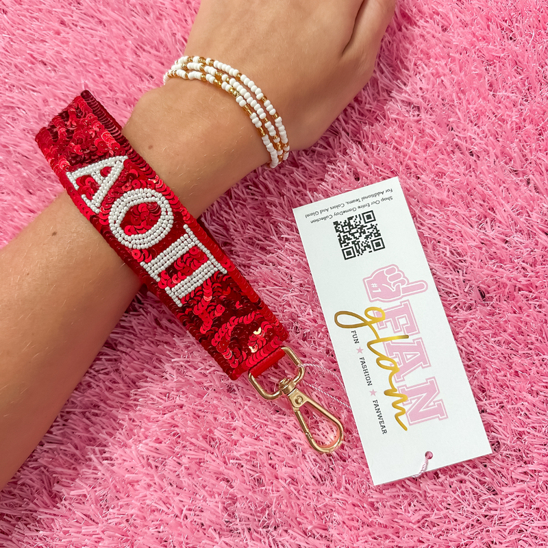 Greek Glam just dropped! This wristlet is serving sparkle, shine, and serious sorority energy — fully sequined and reppin’ your letters loud and proud.&nbsp;Whether you’re heading to chapter, running to class, or getting gift-ready for Bid Day or Big/Little, this piece brings the perfect pop of sorority style. Clip it on, show it off, and let your Greek girl era shine&nbsp;