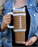 Add a touch of GAME DAY to any outfit with our BROWN CRYSTAL FOOTBALL "Blinged Out" 40 Oz. Tumbler! Indulge in your love for football season and show off your football spirit. These stylish accessories are the perfect addition to your collection, making it easy to flaunt your love for the big game.