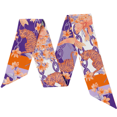 Celebrate your Clemson pride with the South Carolina Silk Scarflette! This playful accessory adds a vibrant touch of Tigers spirit to any outfit. Whether you're cheering at the game or showing off your love around town, its silky texture and bold colors make it a fun and stylish way to support your team. Roar on, Tigers!