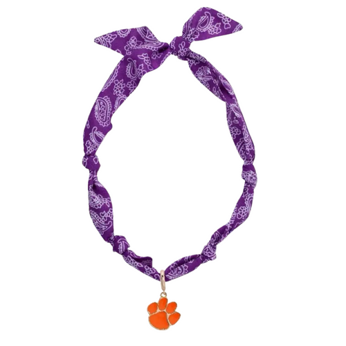Show your Clemson pride in a fresh and fun way with the Clemson Tigers Logo Bandana Scarf Necklace. This lightweight accessory blends the laid-back vibe of a bandana with the stylish touch of a necklace, making it perfect for game days or casual outings. Featuring vibrant orange and purple colors, it’s an easy, playful way to keep your team spirit shining bright all day long.
