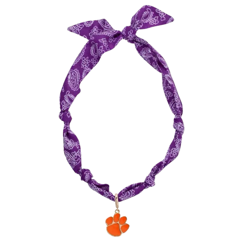 Show your Clemson pride in a fresh and fun way with the Clemson Tigers Logo Bandana Scarf Necklace. This lightweight accessory blends the laid-back vibe of a bandana with the stylish touch of a necklace, making it perfect for game days or casual outings. Featuring vibrant orange and purple colors, it’s an easy, playful way to keep your team spirit shining bright all day long.