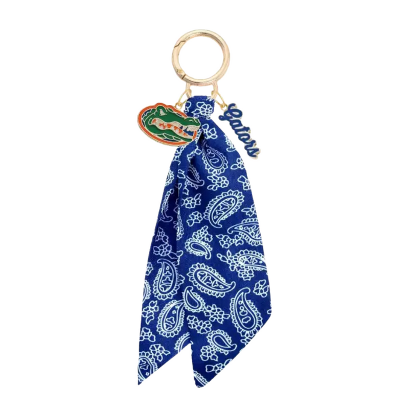 Show off your Florida Gators pride with this playful bandana bag charm! Featuring the iconic Gators logo, it’s the perfect accessory to add a splash of team spirit to your purse, backpack, or keys. Lightweight and easy to attach, this charm lets you carry your fandom wherever you go with a fun, sporty flair.