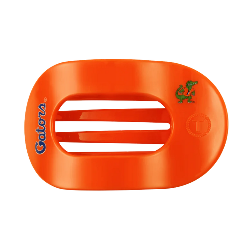 Unwind and relax with the newest TELETIES Flat Round Hair Clip! Designed with the same innovative material that is nearly unbreakable, this clip is perfect for lying down, doing yoga or simply laying back without discomfort. Hold your hair and enhance your style with the new University of Florida TELETIES Clip! Go Gators!&nbsp;