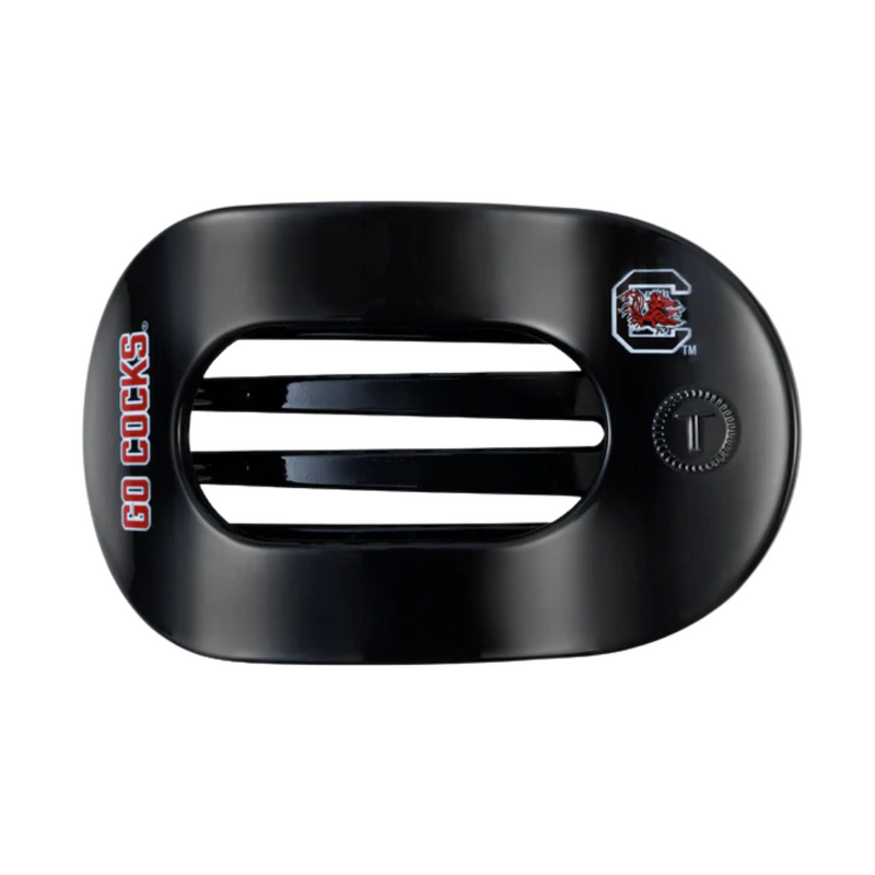 Unwind and relax with the newest TELETIES Flat Round Hair Clip! Designed with the same innovative material that is nearly unbreakable, this clip is perfect for lying down, doing yoga or simply laying back without discomfort. Hold your hair and enhance your style with the new University of South Carolina TELETIES Clip! Go Gamecocks!&nbsp; &nbsp;
