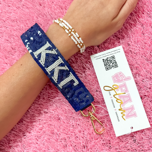 Greek Glam just dropped! This wristlet is serving sparkle, shine, and serious sorority energy — fully sequined and reppin’ your letters loud and proud.&nbsp;Whether you’re heading to chapter, running to class, or getting gift-ready for Bid Day or Big/Little, this piece brings the perfect pop of sorority style. Clip it on, show it off, and let your Greek girl era shine&nbsp;