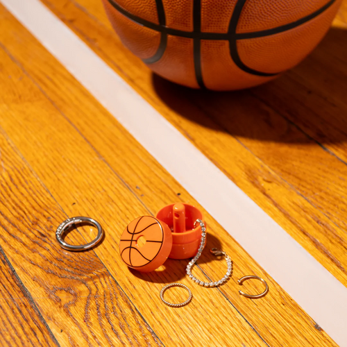 Meet the special edition Basketball Lion Latch! This clever little protector keeps your small jewelry safe on the go with a unique carabiner ring that must be fully removed before opening. Clip it to your keychain, sports bag, or anywhere you like, so your Lion Latch—and your treasures—are always close by and never left behind!