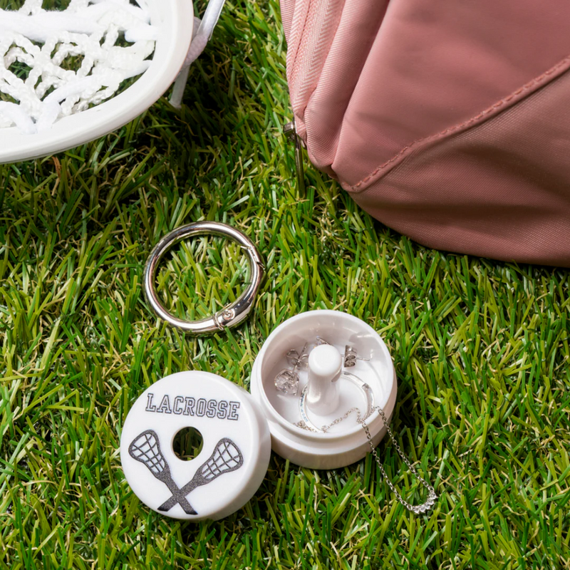 Keep your rings, earrings, and necklaces safe and sound inside the Lion Latch-Lacrosse while you’re out on the field! This playful accessory is perfect for lacrosse players who want to protect their favorite small jewelry during the game. Stay stylish and worry-free with the Lion Latch designed to keep your treasures secure no matter how intense the play gets!