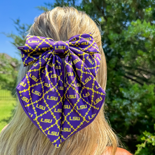 Add a splash of collegiate charm with our Satin Game Day Hair Bow. This playful accessory features a vibrant pattern that’s perfect for showing off your school pride. Whether for game day or everyday fun, this versatile hair bow brings a spirited touch to your collection.
