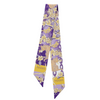 Geaux glam, Tiger style! This LSU-inspired scarflette is loud, proud, and full of Southern sparkle! Featuring a chic floral print in purple and gold with playful tiger silhouettes woven throughout, it's the perfect mix of fierce and feminine. Whether you're tailgating in Baton Rouge, walking to class on campus, or chanting Geaux Tigers! at the top of your lungs, this silky stunner brings big LSU energy to any outfit.