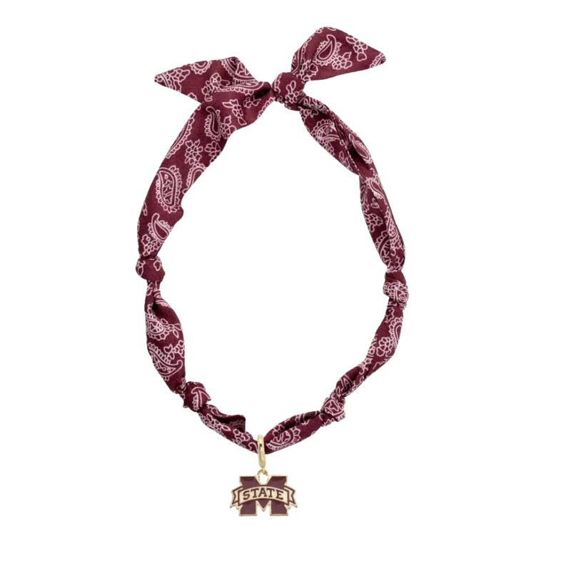 Show off your Bulldogs pride with this playful Mississippi State bandana scarf necklace. Featuring the iconic logo, it’s a fun and stylish way to add a sporty twist to any outfit. Perfect for game days or casual wear, this accessory keeps your look spirited and unique.