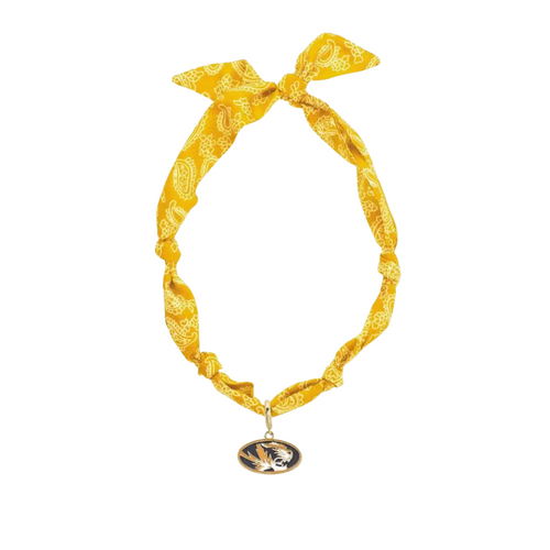 Show off your team spirit with this playful Missouri Tigers Logo Bandana Scarf Necklace. Combining the charm of a bandana with the convenience of a necklace, it’s perfect for adding a fun, sporty touch to any outfit. Lightweight and easy to wear, it’s a great way to cheer on the Tigers in style wherever you go.
