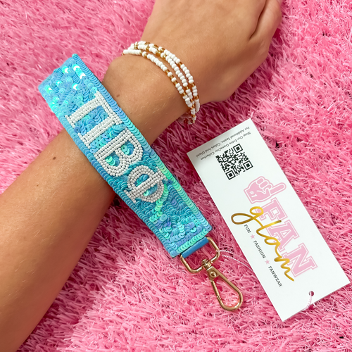 Greek Glam just dropped! This wristlet is serving sparkle, shine, and serious sorority energy — fully sequined and reppin’ your letters loud and proud.&nbsp;Whether you’re heading to chapter, running to class, or getting gift-ready for Bid Day or Big/Little, this piece brings the perfect pop of sorority style. Clip it on, show it off, and let your Greek girl era shine&nbsp;
