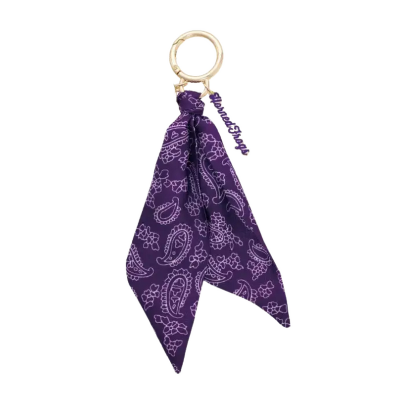Show off your Horned Frog pride with the TCU Frogs Logo Bandana Bag Charm! This playful accessory adds a splash of school spirit to any bag, making it perfect for game days or everyday fun. Lightweight and easy to attach, it’s a charming way to keep your favorite team close wherever you go.