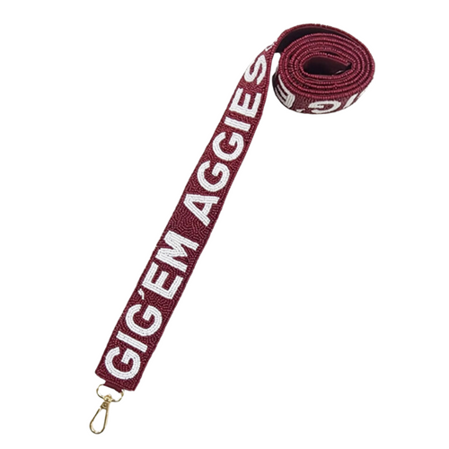 Gig'em Aggies! It's GameDay here in Aggieland and there no better time to elevate your tailgate glam. Accessorize your GameDay look with our uniquely beaded TAMU beaded Gig'em Aggies logo bag strap.