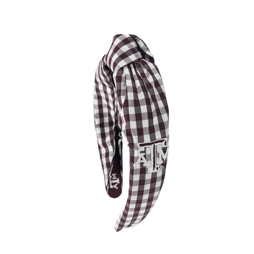 Add a touch of charm to your look with this playful Texas A&amp;M Aggies gingham knot headband. Made from linen gingham fabric, it features an embroidered school logo on the side and sublimated logos inside for a hidden pop of Aggie spirit. Perfect for showing off your team pride with a fun, stylish twist!