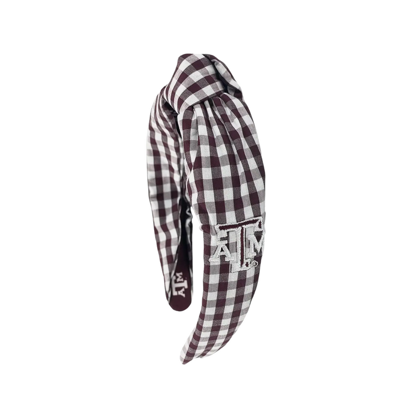 Add a touch of charm to your look with this playful Texas A&amp;M Aggies gingham knot headband. Made from linen gingham fabric, it features an embroidered school logo on the side and sublimated logos inside for a hidden pop of Aggie spirit. Perfect for showing off your team pride with a fun, stylish twist!