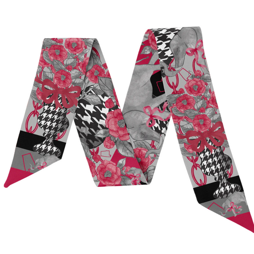 Sweet style from T-Town. This Tuscaloosa-inspired scarflette is all charm, all Crimson, and all about that Bama pride! With soft floral details in crimson and blush plus adorable elephant silhouettes tucked into the print, it’s a playful nod to the traditions and spirit of the Capstone. Whether you're heading to Bryant-Denny, strolling the Strip, or yelling Roll Tide! with your crew, this silky little accessory brings the perfect pop of T-Town flair.