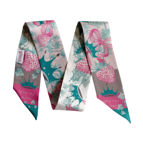 Rock your ZTA pride with this super-cute silk scarflette! Decked out with playful crowns and seven golden links, this fun accessory adds Zeta zing to any outfit! Wear it to class, brunch with sisters, or anytime you want to flaunt your fabulous fraternity love. Mix and match in countless ways – because showing off your Zeta Tau Alpha spirit should always be this stylish and fun!