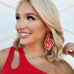 Show off your #1 team status when accessorizing your Game Day look with our dual team colored beaded #1 Foam Finger Dangles!   The perfect accessory to coordinate with your Friday Night Lights ensemble or Saturday tailgate style.