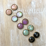 Add a little sparkle to your everyday with our Sweet + Chic gold flecked circle studs! 