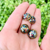 Everything is better with a little Funfetti!! Add a little sparkle and rainbow delight to your jewelry box with our super sweet multi colored circle stud earrings.