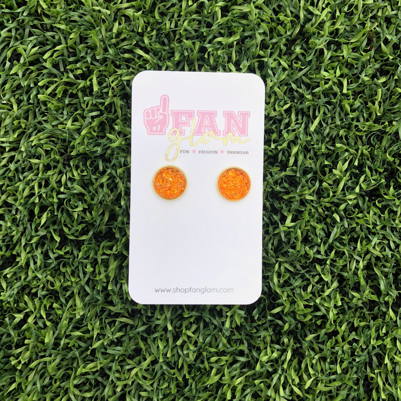 Our GameDay Circle Stud Earrings are the perfect pop of color for game time and a fun substitute for your everyday earrings!  Available in ten bright colors, it's easy to mix and match all your favorite teams!