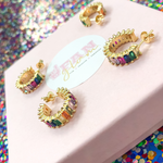Our mini multi crystal rainbow hoop earrings are the perfect nod to the Art Deco era, defined by a row of baguette crystals with high shimmer and shine.  They will become an everyday go-to favorite that can mix and match with your entire wardrobe. 