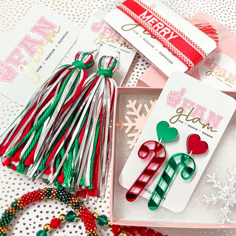 Our Holiday Glitter Glam Dangle earrings are the perfect combination of bright colors, fun prints, and holiday designs that bring cheer!   Available in an array of festive colors and styles, you can pick and choose all your favorites.  The perfect Secret Santa Gift for all your besties!