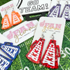 When in doubt, cheer it out. Our GameDay Glitter Glam Cheer Megaphone earrings are the perfect pop of color + glam for game time! Super lightweight and comfortable, you will forget you have them on.  Available in over a dozen fun colors, it's easy to mix and match all your favorite teams!  