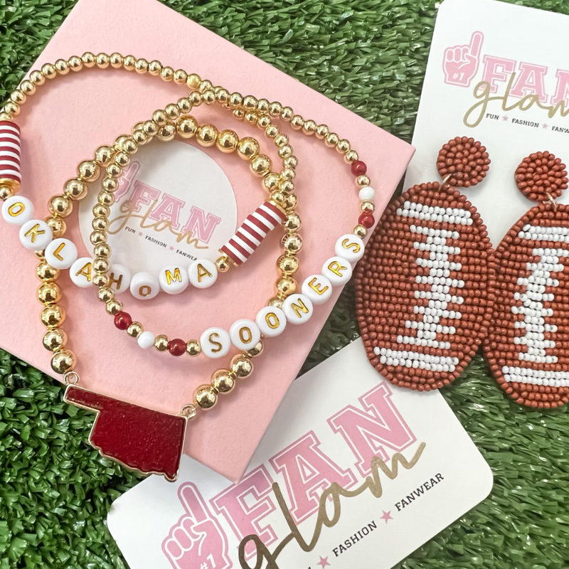Our new BallGame Baubles are a perfect add-on layer to your GameDay Stack.  Sporty + chic you can mix elegant gold or silver beads with your favorite team colors to create the perfect layering stack!