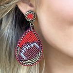 Show your love for the game when accessorizing your Game Day look with these dual colored uniquely beaded football earrings!   The perfect accessory to coordinate with your Friday Night Lights ensemble or Saturday tailgate style.