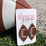 Show your love for the game when accessorizing your Game Day look with these uniquely beaded football stud earrings!   The perfect accessory to coordinate with your Friday Night ensemble.  