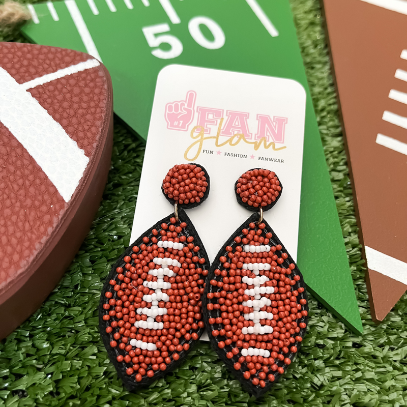 Show your love for the game when accessorizing your Game Day look with these uniquely beaded football stud earrings!   The perfect accessory to get you fired up for the playoffs this season!