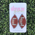 Show your love for the game when accessorizing your Game Day look with these uniquely beaded football stud earrings!   The perfect accessory to coordinate with your Friday Night ensemble.  