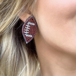 Show your love for the game when accessorizing your Game Day look with these uniquely beaded football stud earrings!   The perfect accessory to coordinate with your Friday Night Lights ensemble.  