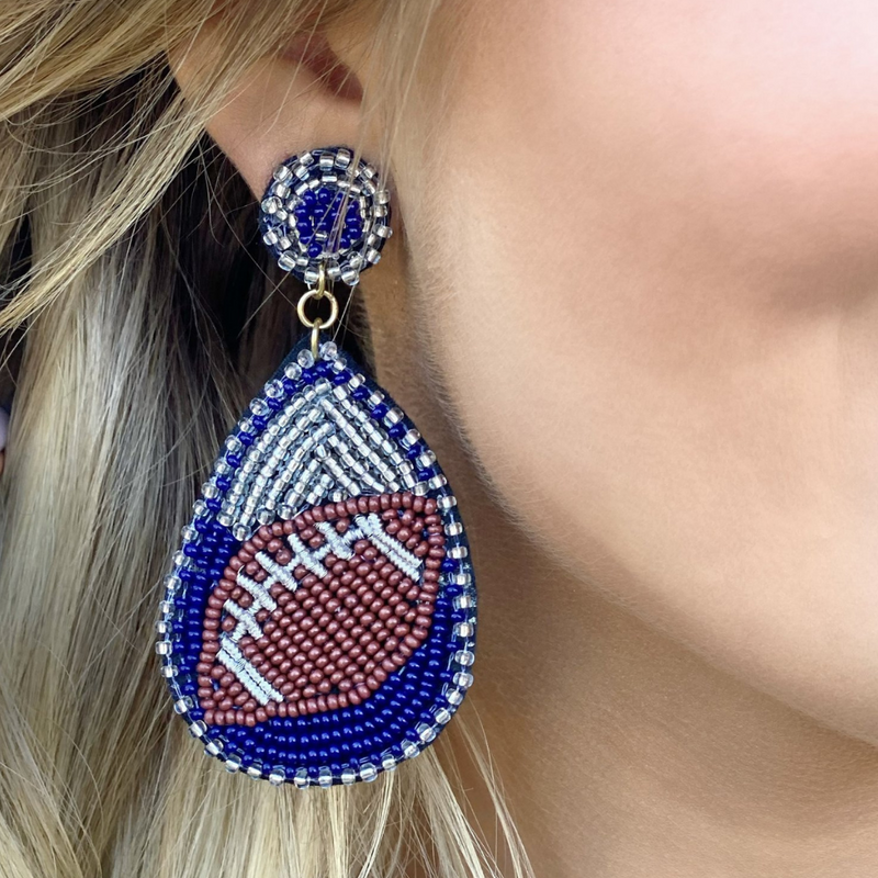 Show your love for the game when accessorizing your Game Day look with these dual colored uniquely beaded football earrings!   The perfect accessory to coordinate with your Friday Night Lights ensemble or Saturday tailgate style.