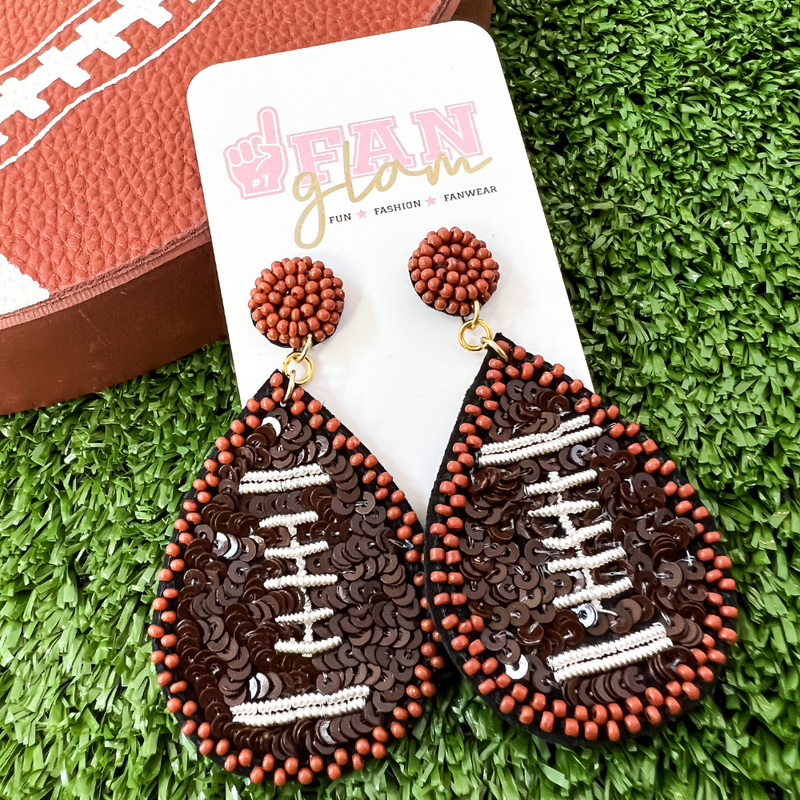Show your love for the game when accessorizing your Game Day look with these uniquely sequined sports ball dangle earrings!   The perfect accessory to help coordinate with your Gameday ensemble.