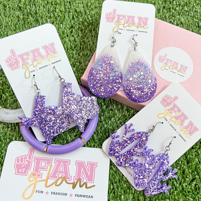 Our GameDay Glitter Glam Purple Collection is the perfect pop of color + glam for game time! Show off your team OR Texas state pride while sporting your favorite teams colors.