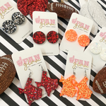 My new favorite go-to!  Our GameDay Glitter Glam Round Stud Earrings are the perfect pop of color + glam for game time! Super lightweight and comfortable, you will forget you have them on.  Available in over a dozen fun colors, it's easy to mix and match all your favorite teams!