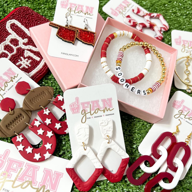 Our GameDay Glitter Glam State Of Oklahoma earrings are the perfect pop of color + glam for game time! Show off your Boomer Sooner pride while sporting your favorite team colors.