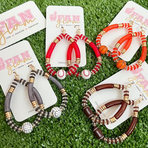 Show your love for the game when accessorizing your Game Day look with these uniquely beaded sports ball hoop dangle earrings!   The perfect accessory to help coordinate with your Gameday ensemble.  Available in four different sport options: Football, Basketball, Baseball and Volleyball you'll be glam in the stands for each of your player's favorite teams!  Collect all 4!