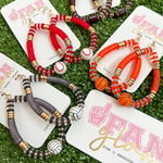 Show your love for the game when accessorizing your Game Day look with these uniquely beaded sports ball hoop dangle earrings!   The perfect accessory to help coordinate with your Gameday ensemble.  Available in four different sport options: Football, Basketball, Baseball and Volleyball you'll be glam in the stands for each of your player's favorite teams!  Collect all 4!