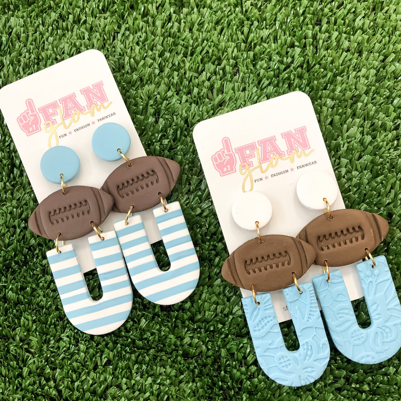 Our GameDay Tam Clay Co Light Blue Collection features five collectable styles, it's the perfect way to add team color and a fun pop of print to your gameday attire.
