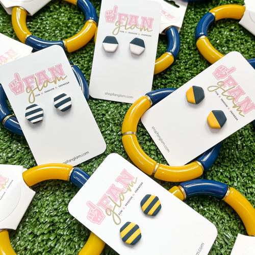 Our GameDay Tam Clay Co Navy Collection features four fun collectable styles.  It's the perfect way to add some team color and a fun pop of print to your gameday attire for the big game this weekend. 